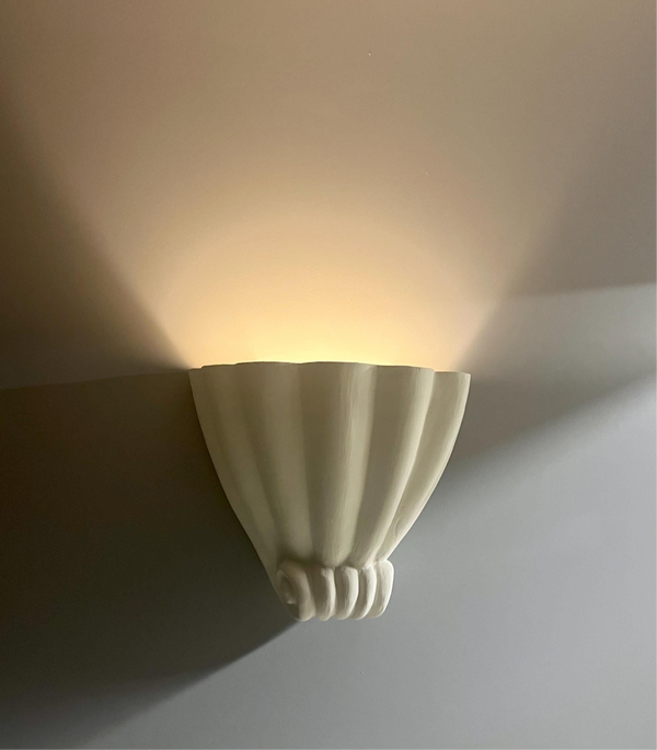 Shell wall lamps in plaster