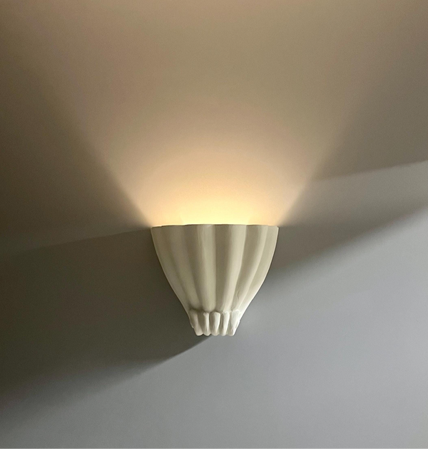 Shell wall lamps in plaster