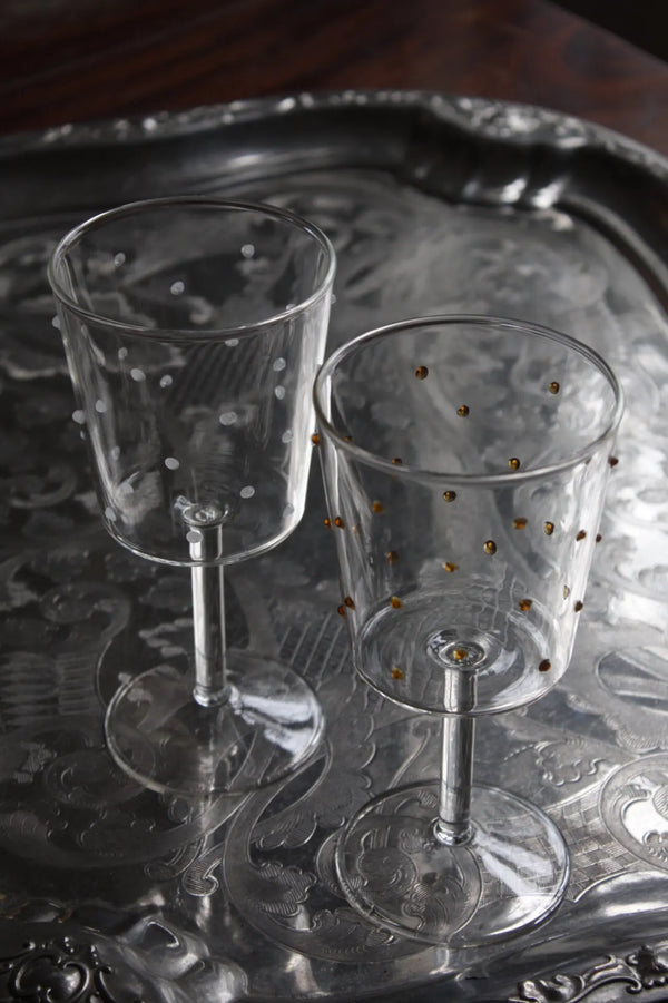 Wine glas with small white dots