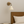 Vegglampe messing og glanset skjerm