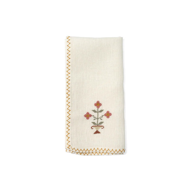 Hand-embroidered napkins in yellow linen with a pink flower